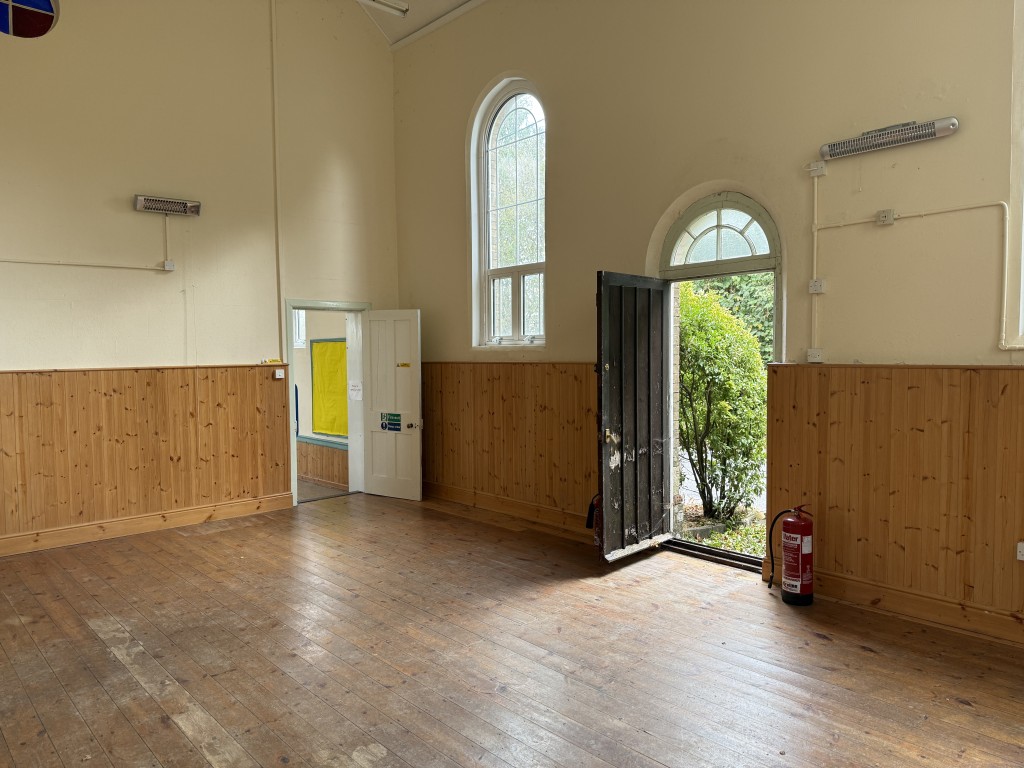 Lot: 170 - FORMER METHODIST CHAPEL WITH PLANNING FOR CONVERSION TO A RESIDENTIAL DWELLING ON PLOT OF 0.39 ACRES - School hall showing entrance door